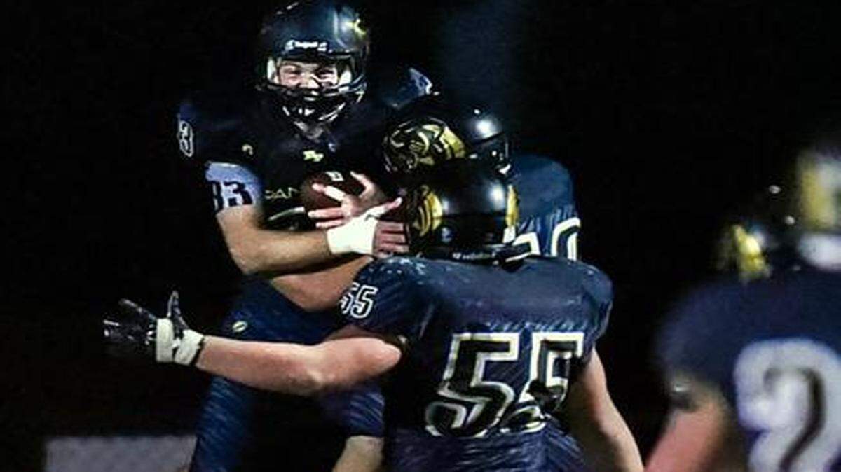 
Raymore-Peculiar defensive lineman Ben Harris (left) was ecstatic after he returned an interception for a touchdown Friday.
