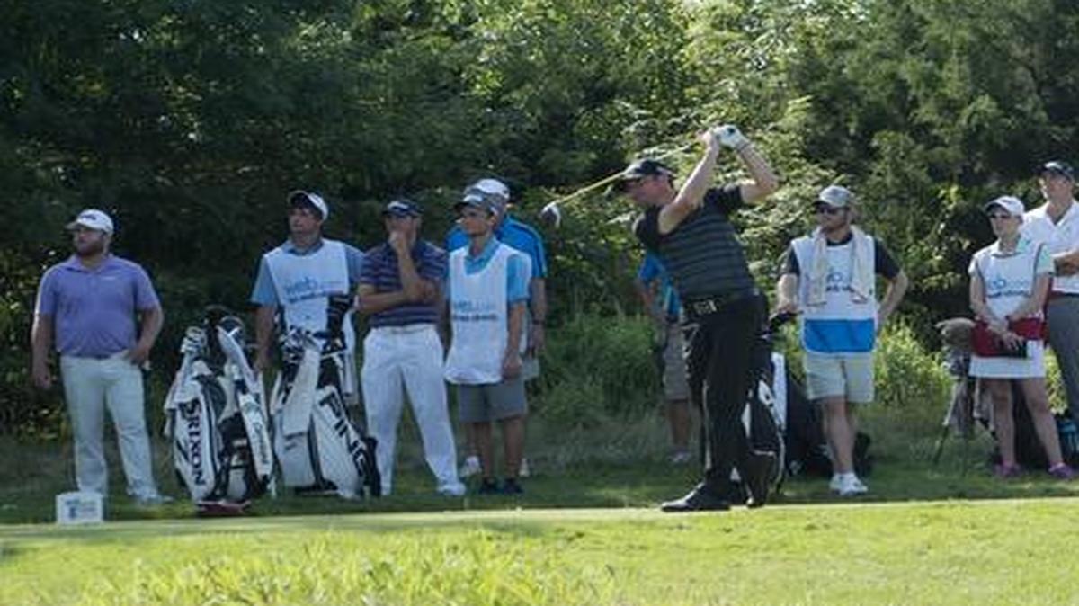Jimmy Gunn of Meza, Ariz., hit the ball off tee as fans watched last Thursday during the Digital Ally Open on the Web.com Tour at the Nicklaus Golf Club at LionsGate in Overland Park.