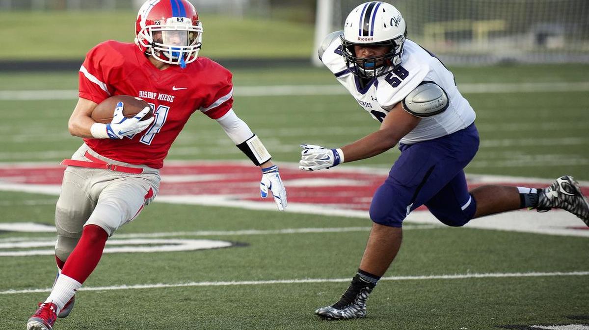 
Bishop Miege wide receiver Danny Murphy runs for yardage against Blue Valley Northwest High during their game Friday night.
