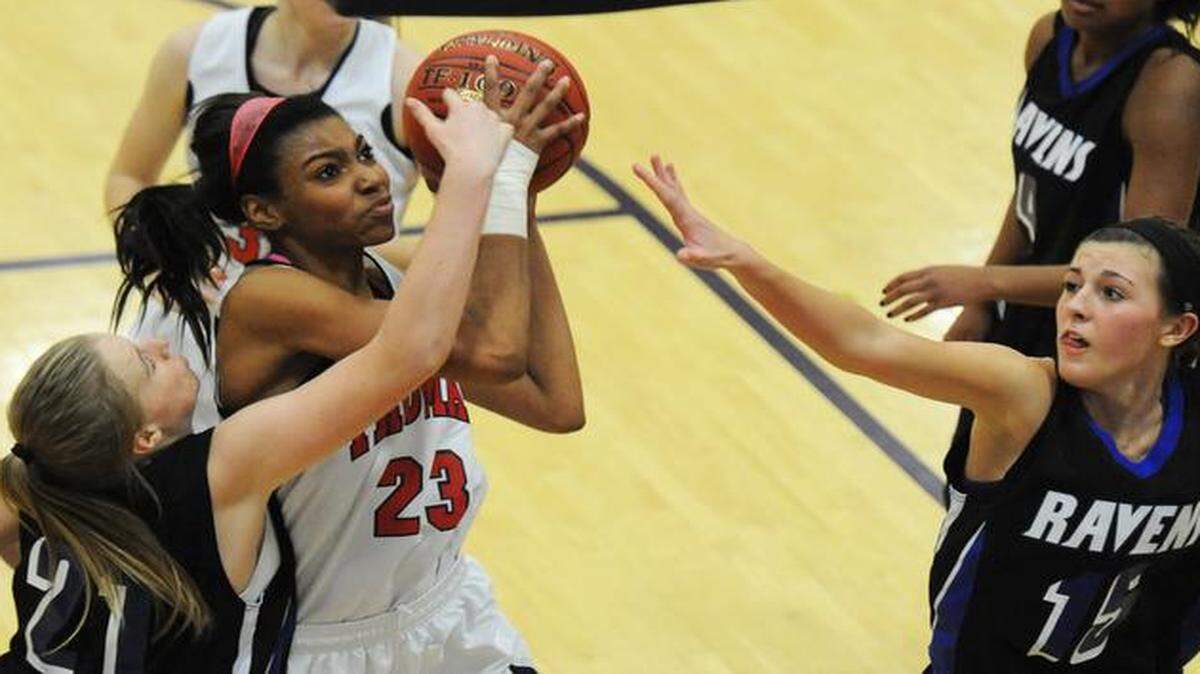 
Truman High’s Kierra Collier took a shot against Olathe Northwest’s Kaylie Kappelmann (left) and Sami Marks during Wednesday’s game at the Hy-Vee Shootout. Collier finished with a game-high 25 points. 


