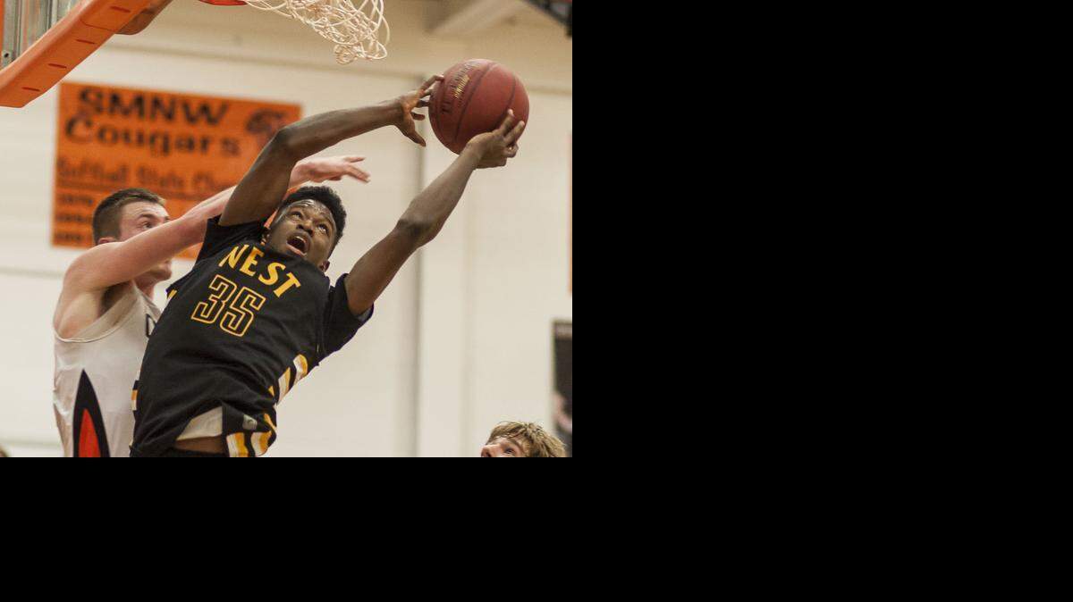 
SM West’s Darrell Stewart (right) was fouled on a layup attempt by SM Northwest’s Austin Sanders during Friday’s game at SM Northwest.
