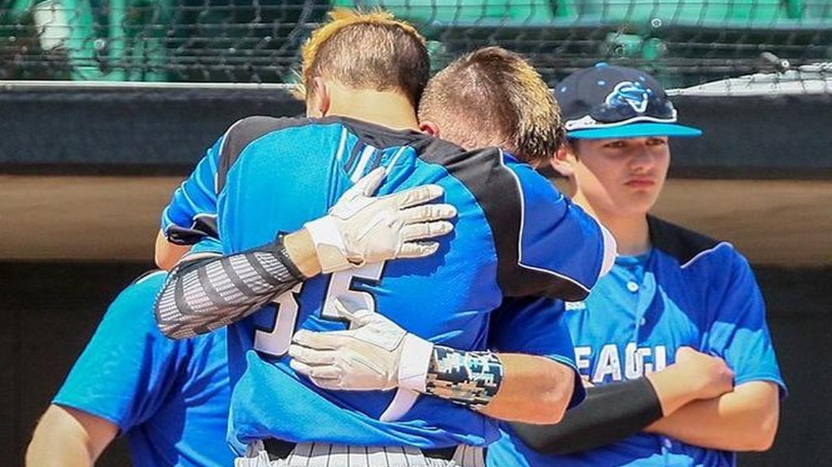 Summit Christian senior Zachary Gensky (rear) embraced Summit Christian senior Robert Suhr following the loss to Mountain Grove in the Class 3 Missouri State baseball title game Thursday at CarShield Field in O’Fallon, Mo.