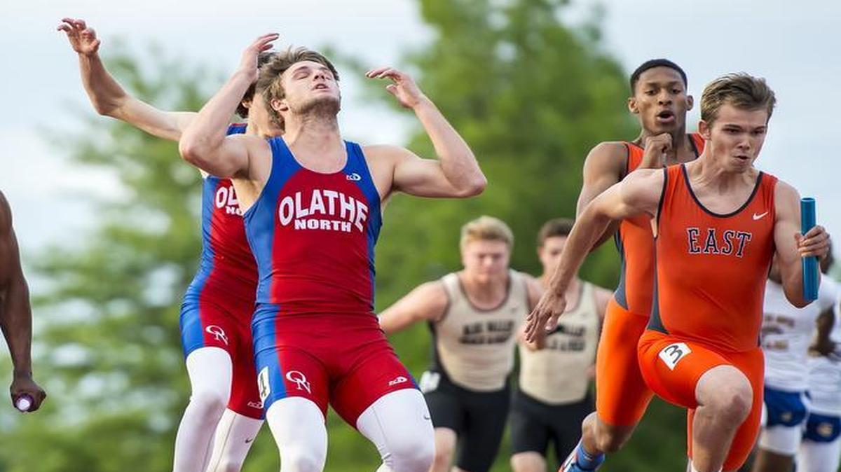 
Olathe North’s Cole Murphy (left) reacted in frustration after missing the final baton handoff from a teammate in the 400 meter relay on Friday at the Kansas 6A regional track meet at the Olathe District Activity Center.

