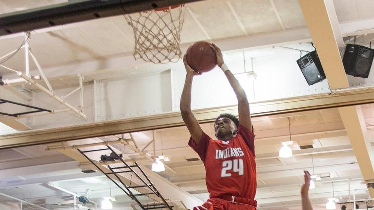 Shawnee Mission North’s Michael Weathers went up for a dunk in a game Friday at Shawnee Mission East.