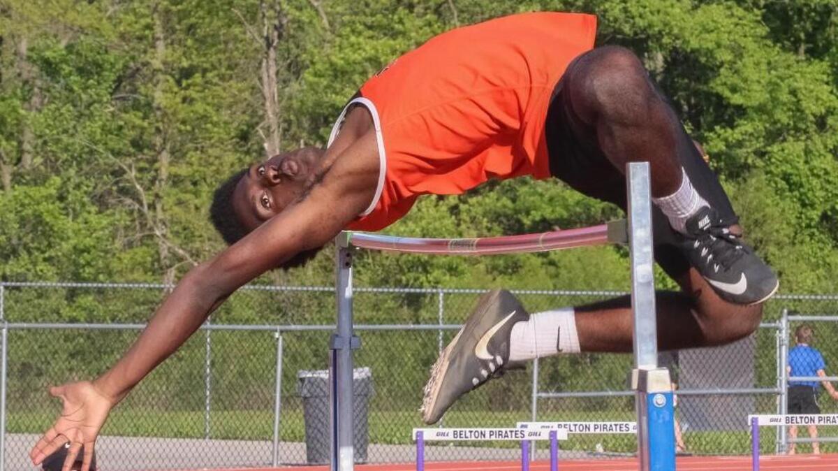 Trey Reece of Platte County goes over the bar in the boys high jump in the Suburban Blue Conference track meet Friday at Belton. Reece finished in fourth place.