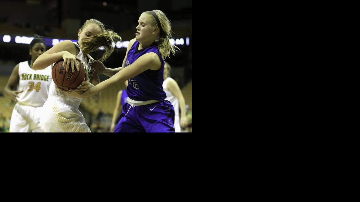 
Carly Offerdahl (left) of Rock Bridge and Morgan Fleming of Liberty battled for control of the basketball during their Missouri Class 5 girls state championship game last Saturday at the Show-Me Showdown at Mizzou Arena.
