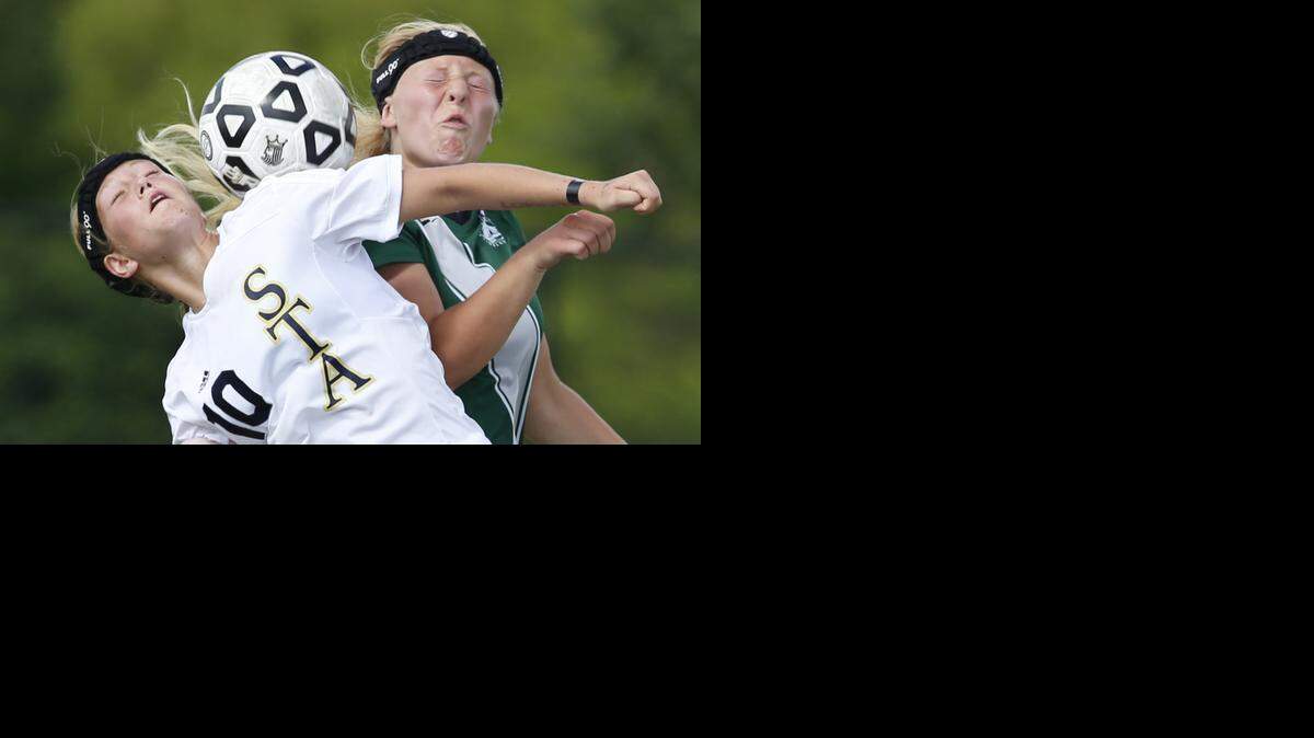 
Mary Disidore (left) of St. Thomas Aquinas and Blue Valley Southwest’s Kelsey Hailey battle for a ball on Saturday in the Kansas Class 5A girls soccer state championship game in Emporia. 
