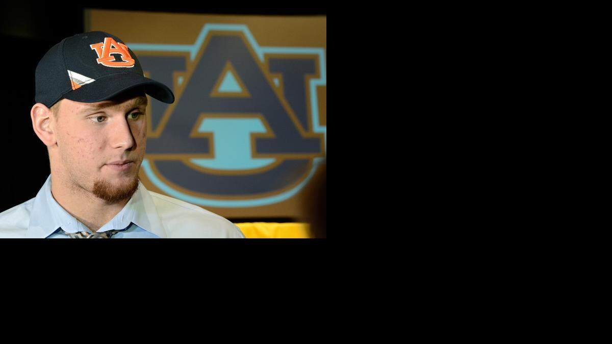 
Olathe South High School's Braden Smith wears his Auburn hat after choosing the school to play football on Wednesday, February 5, 2014 in Olathe, Kan.
