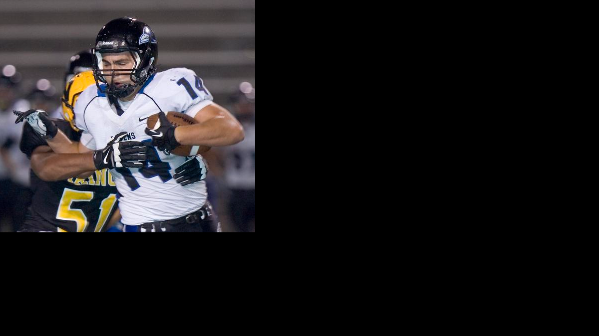 
Olathe Northwest's Adam Harter (with ball) will be a leader on offense and defense this season for the Ravens.
