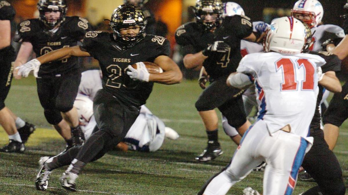 Blue Valley running back William Evans looks for an opening against Olathe North during their Kansas Class 6A substate playoff game on Friday night. Blue Valley defeated the Eagles, 43-19.