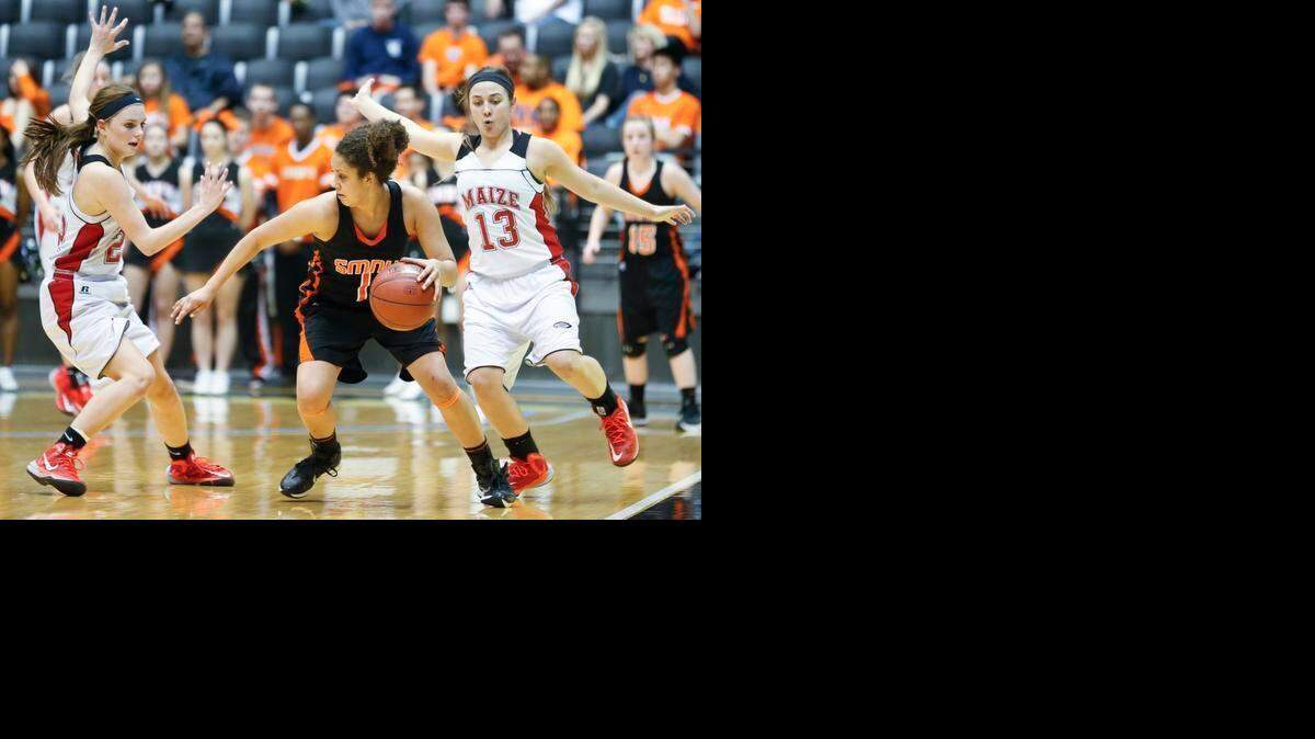 
Shawnee Mission Northwest’s Brooklyn Wagler (with ball) encounters pressur by Maize’s Taylor Holmes (left) and Hayle Roiland in the fourth quarter of their Kanasas Class 6A girls state semifinal game on Friday at Koch Arena in Wichita. Maize defeated the Cougars 37-27.
