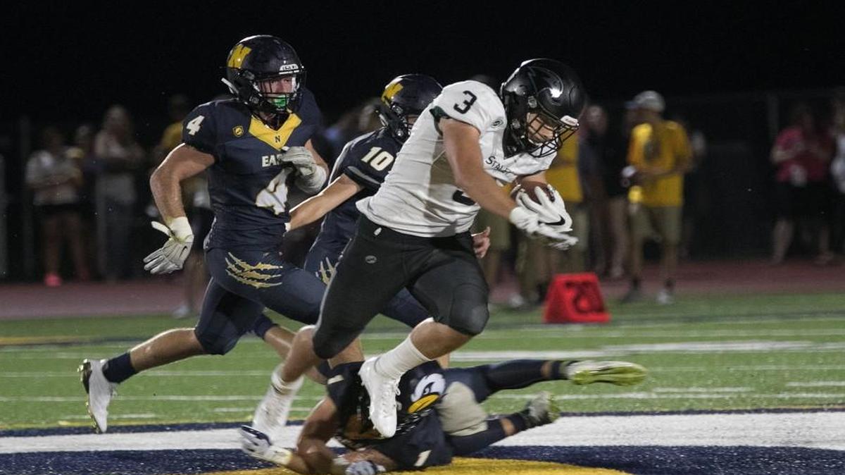 JD Benbow of Staley barrels for yardage in a recent game against Liberty North.