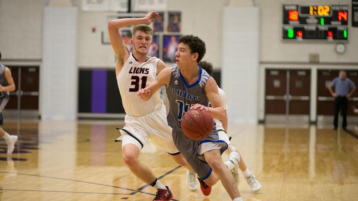 Jackson Mallory of Lawrence (left) was selected to the first team of the Sunflower League All-Conference boys basketball team.