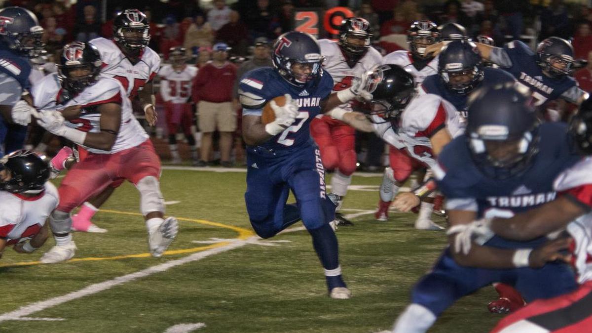 Truman running back Jordan Salima ran the football through a maze of teammates and Park Hill defenders during their game on Friday night.