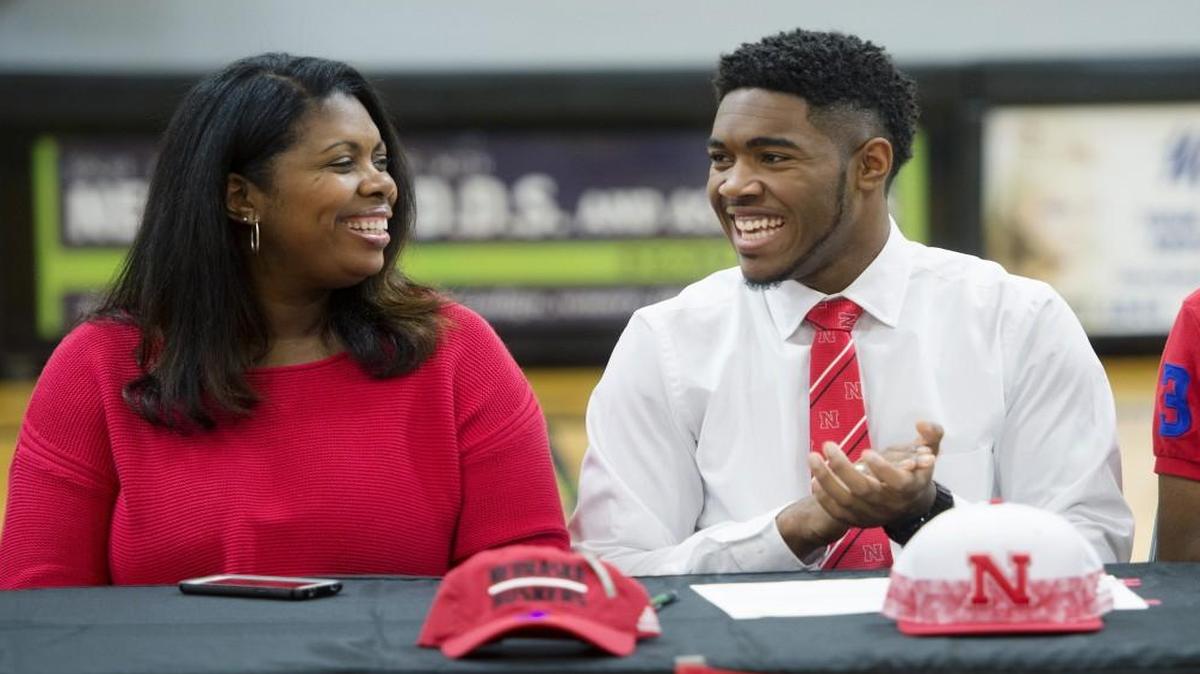 Jeriah Horne (right), a standout basketball player at The Barstow School, had a laugh with his mother, Tashannah Horne, before he signed his letter of intent on Wednesday to play basketball at Nebraska.