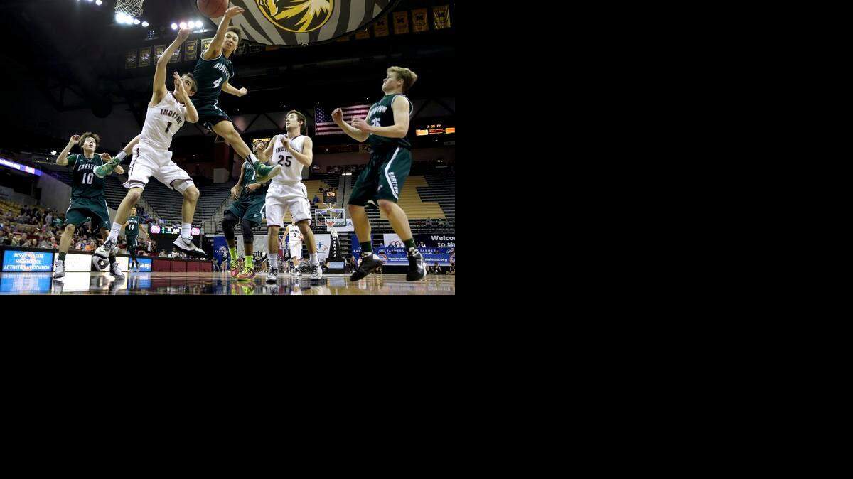
Barstow’s Shea Rush blocked a shot by Strafford’s Kyle Foley during the second half of the Missouri Class 3 high school boys championship basketball game on Saturday in Columbia.
