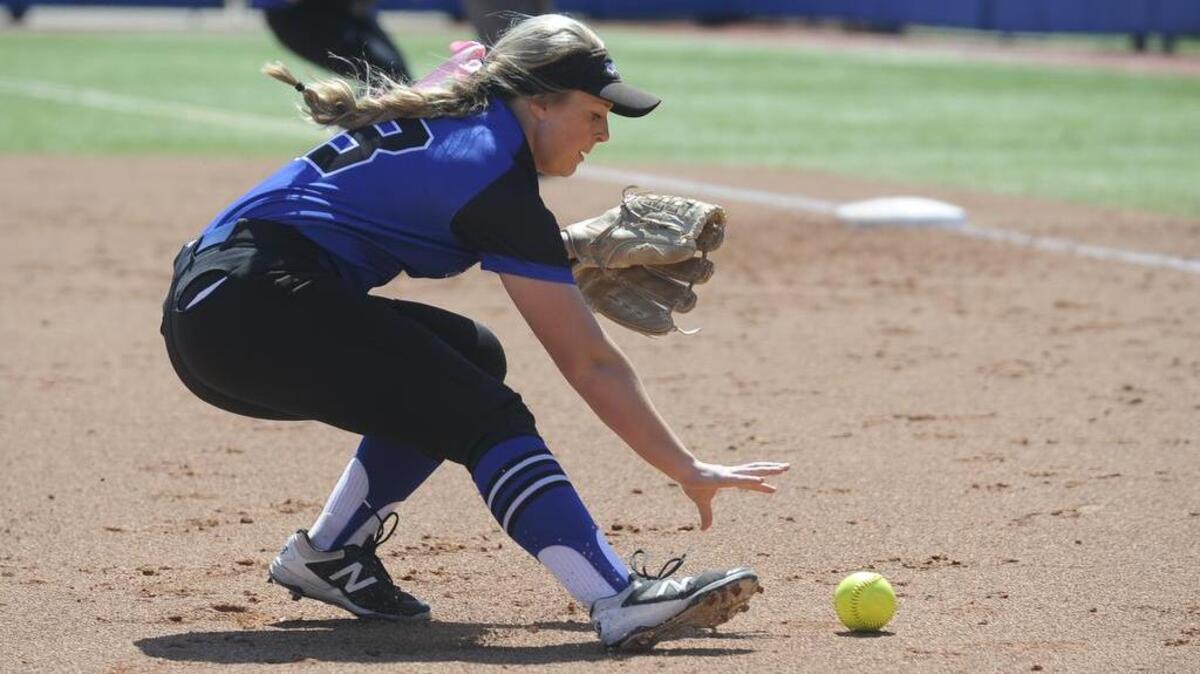 Olathe Northwest pitcher Natalie Hamm rushes to field a bunt during a 6-5 win over Haysville on Thursday.