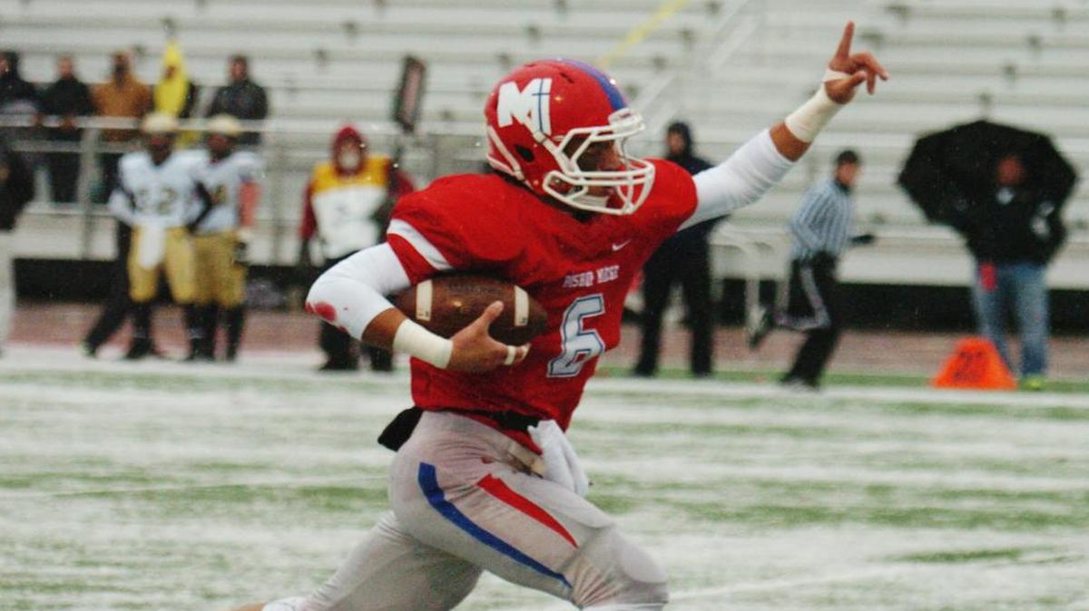 Bishop Miege’s Ray Vaca scores a touchdown after a fumble recovery during the Stags’ 68-12 victory over Andover Central on Saturday in the Kansas Class 4A Division I state championship game at Hummer Sports Complex.