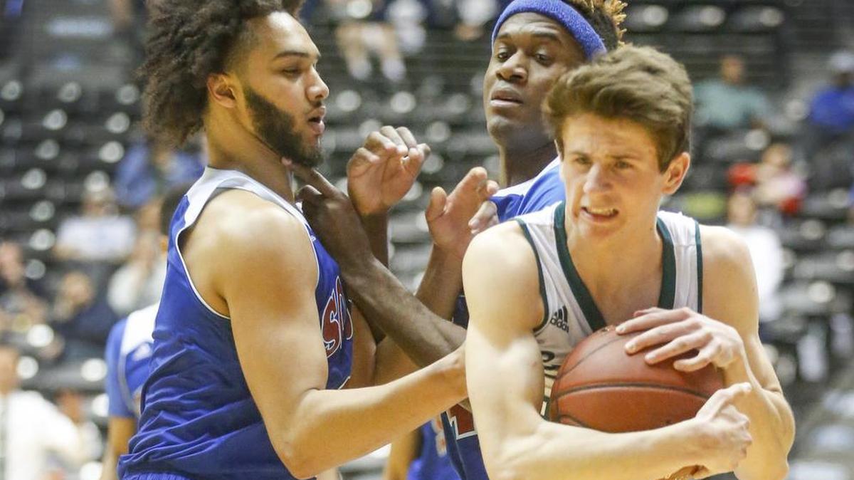 Former Lawrence Free State point guard Garrett Luinstra (right) has decided to transfer from Kansas to Central Missouri.