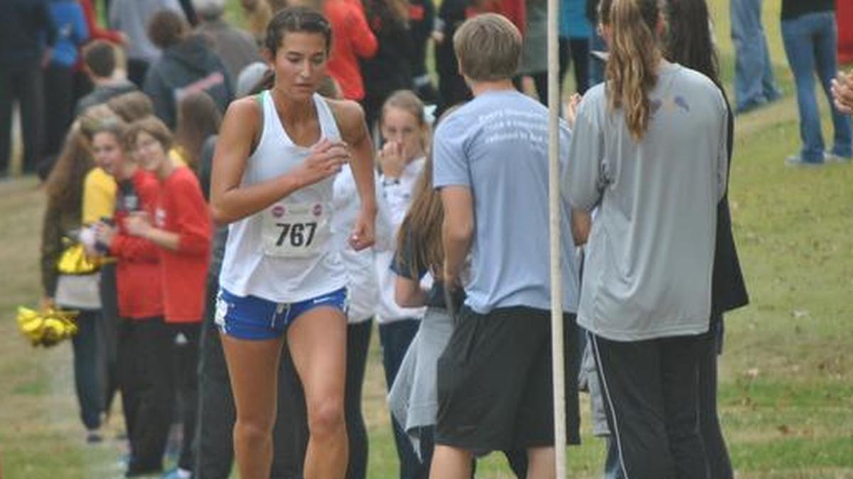 Blue Springs South senior Tori Findley (center) outran the rest of the field in the Missouri Class 4 girls cross country state championships on the hilly 5-kilometer course at the Oak Hills Golf Center in Jefferson City on Saturday.