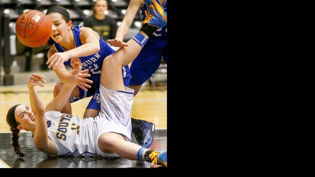 
Washburn Rural’s Jordyn Musselman (top) pressured Olathe South's Zoe Matje in the fourth quarter during their Class 6A state quarterfinal game Thursday at Koch Arena in Wichita.
