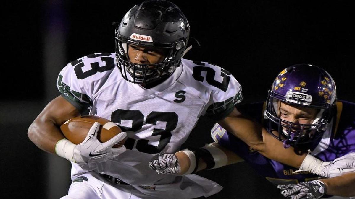 Kearney had a tough time stopping Staley’s Julian Ross (left) on Friday night at Kearney.