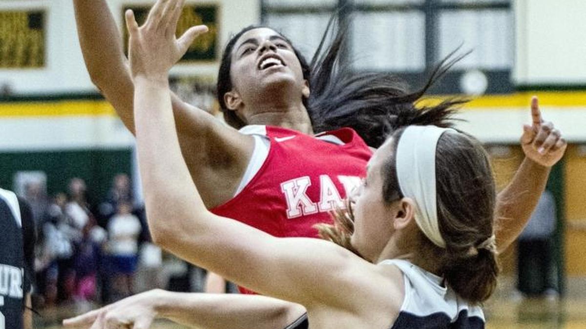 Missouri player Alex Berger from Park Hill tries to keep Kansas player Hunter Bentley from getting to the basket during the Kansas vs. Missouri High School All Star Challenge at Shawnee Mission South. Missouri defeated Kansas 56-54 in the girls game.