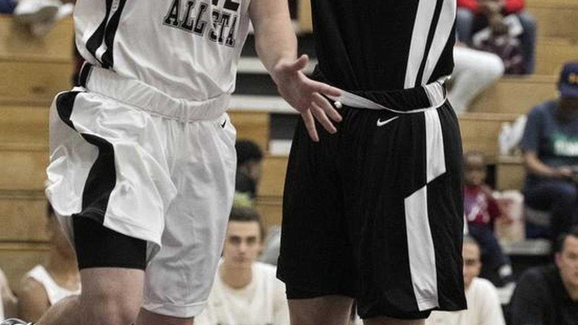Olathe Northwest’s Jackson Nicodemus (left) tried a layup against Lee’s Summit West’s Christian Bishop during the Kansas vs. Missouri High School All-Star Challenge on April 13 at Avila University.