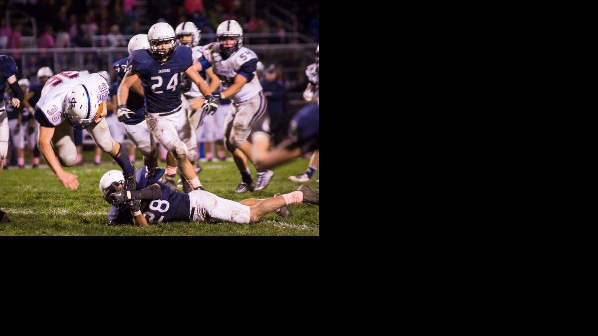 
Jake Burgmeier of St. James Academy was tripped up by Bryan Burnett of Mill Valley during their game earlier this season. If Mill Valley accepts an invitation, this game could soon be an Eastern Kansas League football game.
