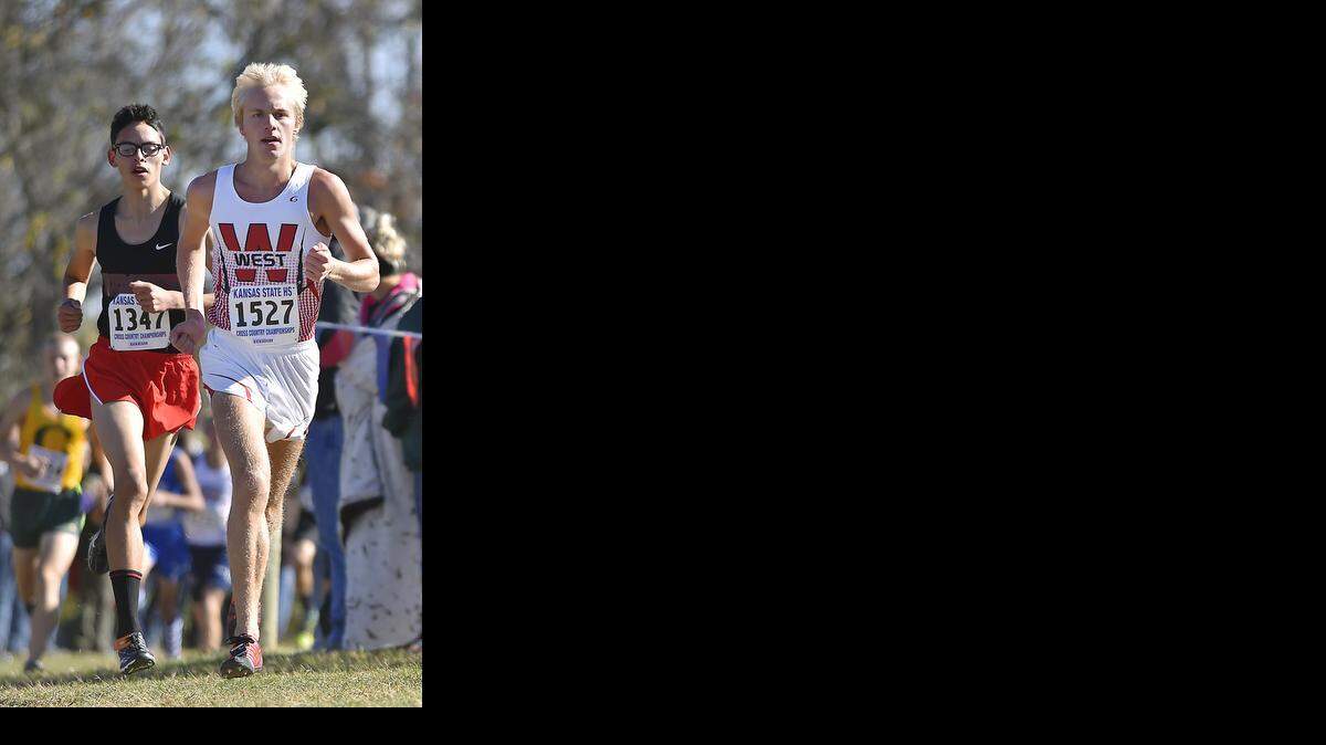 
The Kansas high school cross country state championship took place at Rim Rock Farm on Friday in Lawrence. Stuart McNutt (front) of Blue Valley West placed first in the Class 5A boys race.
