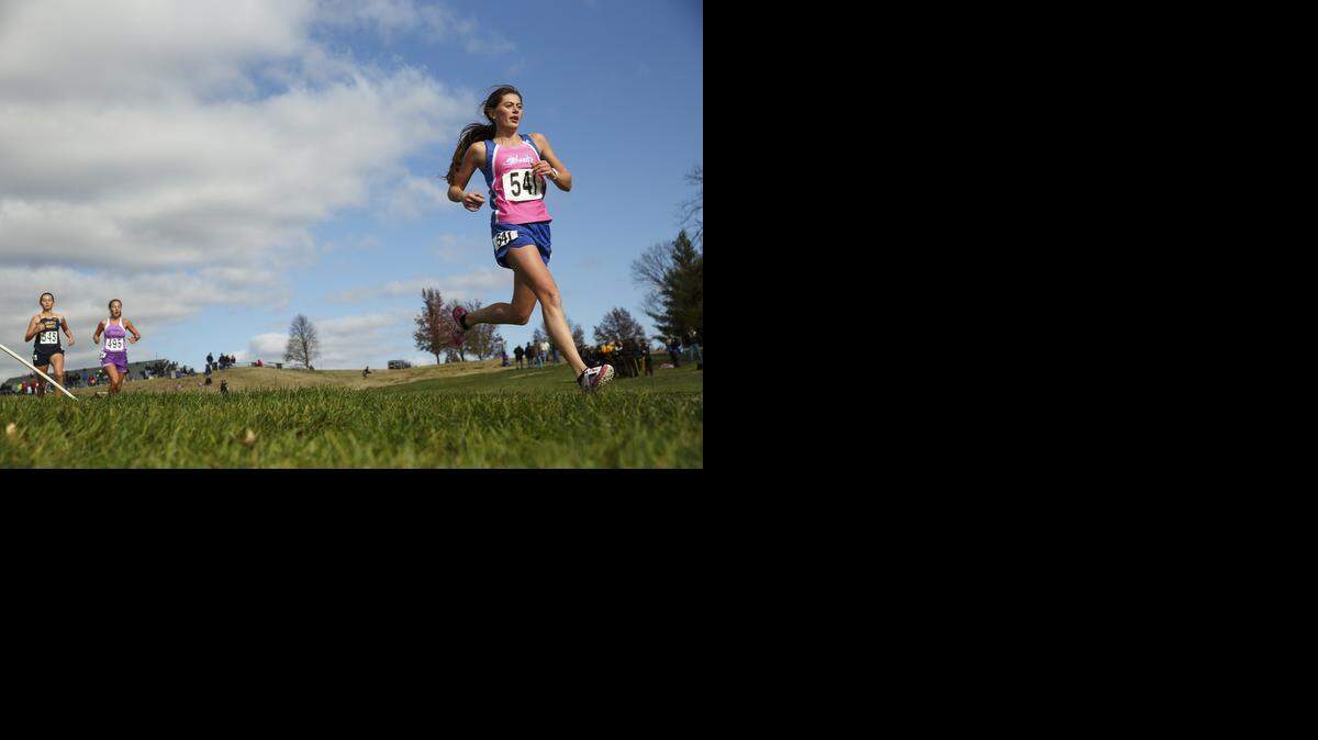 
Madison Nasteff (right) of Liberty High School tackled the course in the Class 4 girls race at the MSHSAA Cross Country State Championships on Saturday in Jefferson City. She placed 15th.
