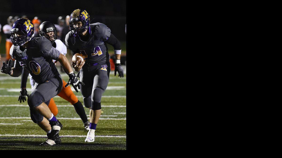
Kearney quarterback Johnny Weidmaier (with ball) follows his blocker in a game against Platte County earlier this season.
