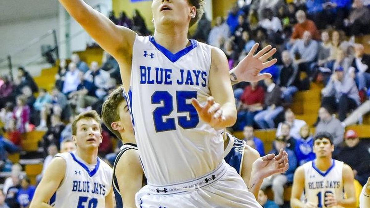 Clayton Adams of Liberty goes in for a layup against Liberty in a Cardinal Division first-round game Wednesday. The Blue Jays won 59-43 en route to a fourth-place finish.