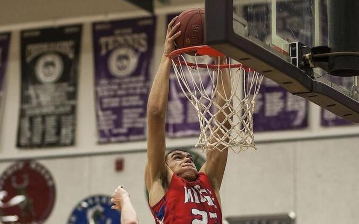 Miege's Francesco Badocchi dunks during a game between Bishop Miege and Blue Valley Northwest at Blue Valley Northwest High School in Overland Park, Ks on February 12, 2016.