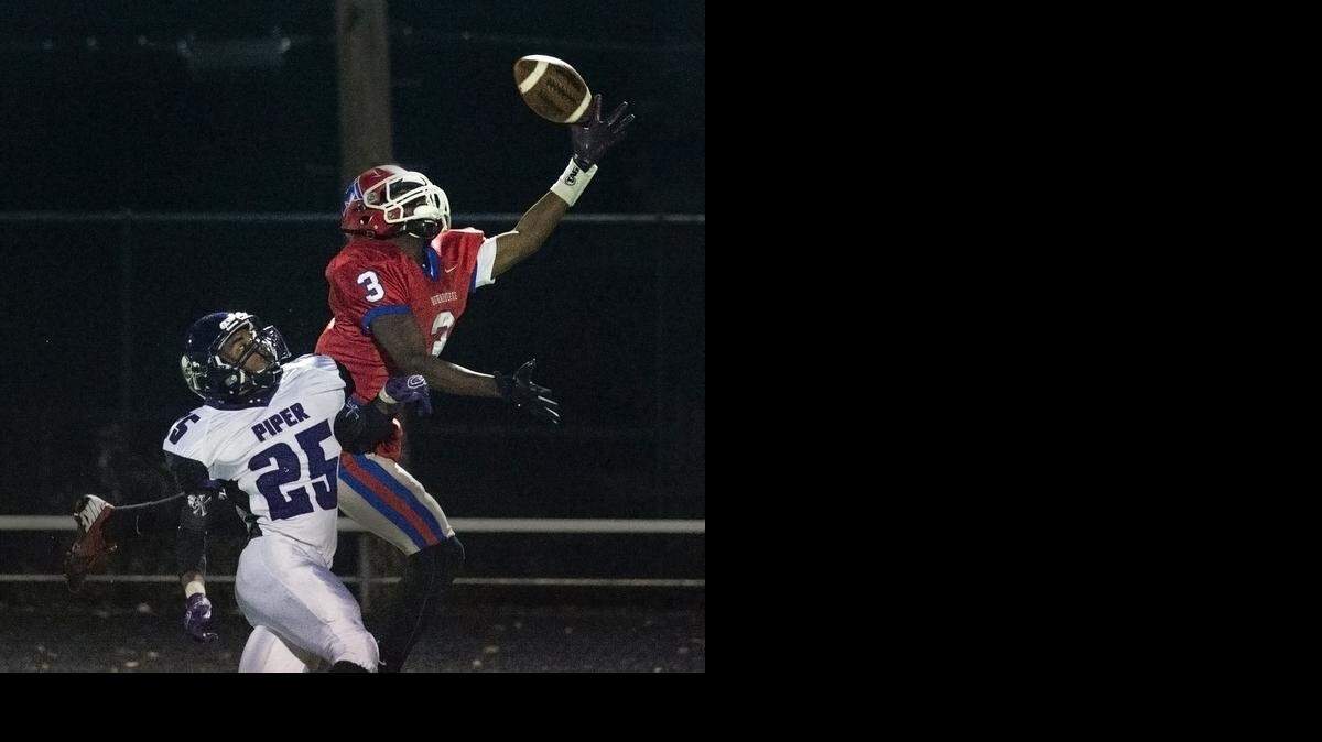 
Piper’s Devin McIntosh (left) was flagged for pass interference while trying to defend Bishop Miege’s Jafar Armstrong on Friday night in their Kansas Class 4A Division 1 substate game.
