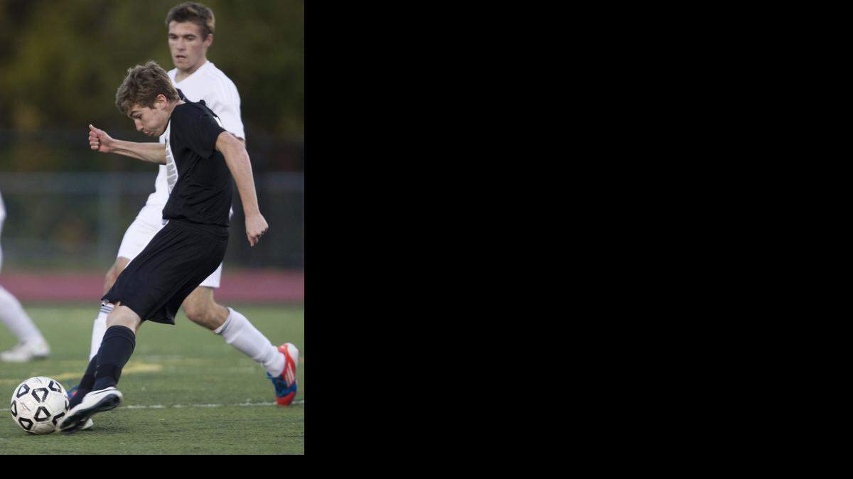 
Shawnee Mission Northwest’s Ethan Bowman (front), seen here in a 2013 match against SM South, is the Sunflower League’s midfielder of the year.
