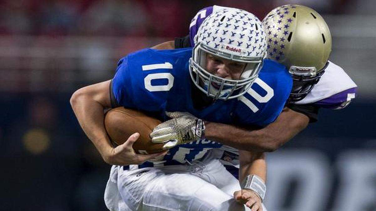
Rockhurst’s T.J. Green was sacked by Christian Brothers’ Michael Jones in Saturday’s Missouri Class 6 championship game at the Edward Jones Dome in St. Louis.
