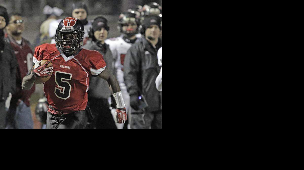 
Park Hill backup quarterback Jeremiah Benson turned the corner for his second touchdown on Friday night in the Trojans’ 21-20 victory over Fort Osage.
