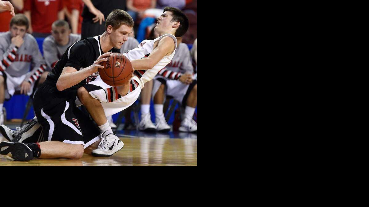 
Wichita Heights’ Davis Banner (left) and Blue Valley West’s Michael Chalupa collide in the fourth quarter of their Kansas Class 5A boys state semifinal game on Friday.Wichita Heights defeated Blue Valley West 53-38.
