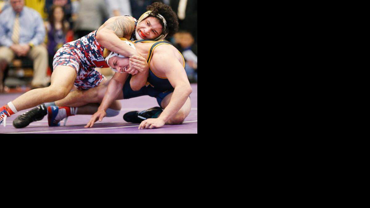 
Olathe North’s Isaac Dulgarian (top) beat Wichita Northwest’s Saul Ortiz in the Kansas Class 6A final in the 170-pound class. It was his third straight state title. Dulgarian finished this season 45-0.


