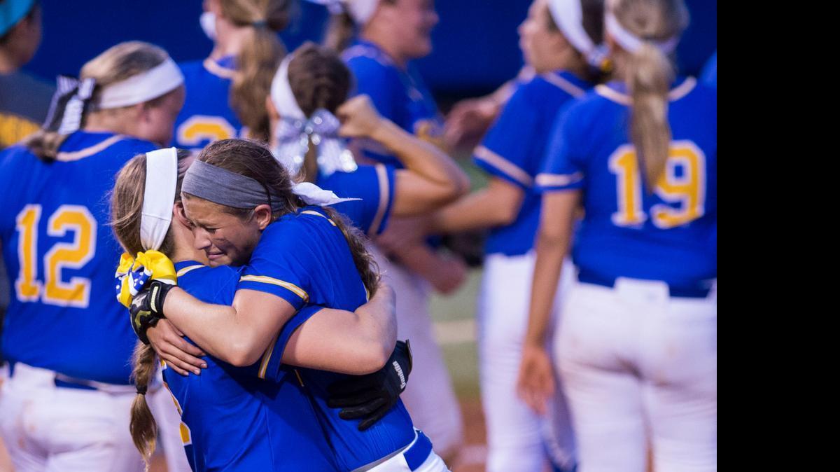 
Olathe South’s Samantha Bates (left) and Alyssa Bates celebrated after the Falcons defeated Olathe Northwest 7-3 victory in the Kansas 6A softball state championship game Friday at Rock Chalk Park in Lawrence.
