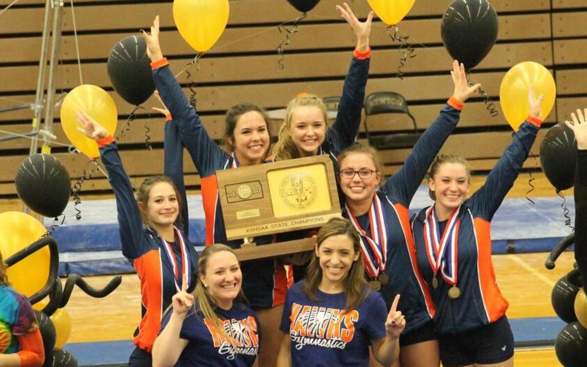 The Olathe East High School gymnastics team celebrated their team title on Saturday at the Kansas state meet in Newton, Kan.
