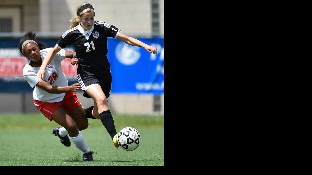 
Maize’s Mia Taylor (right) got bumped by BV Northwest’s Sarah Fugate on this possession as the Huskies romped to the Kansas Class 6A girls soccer state title.
