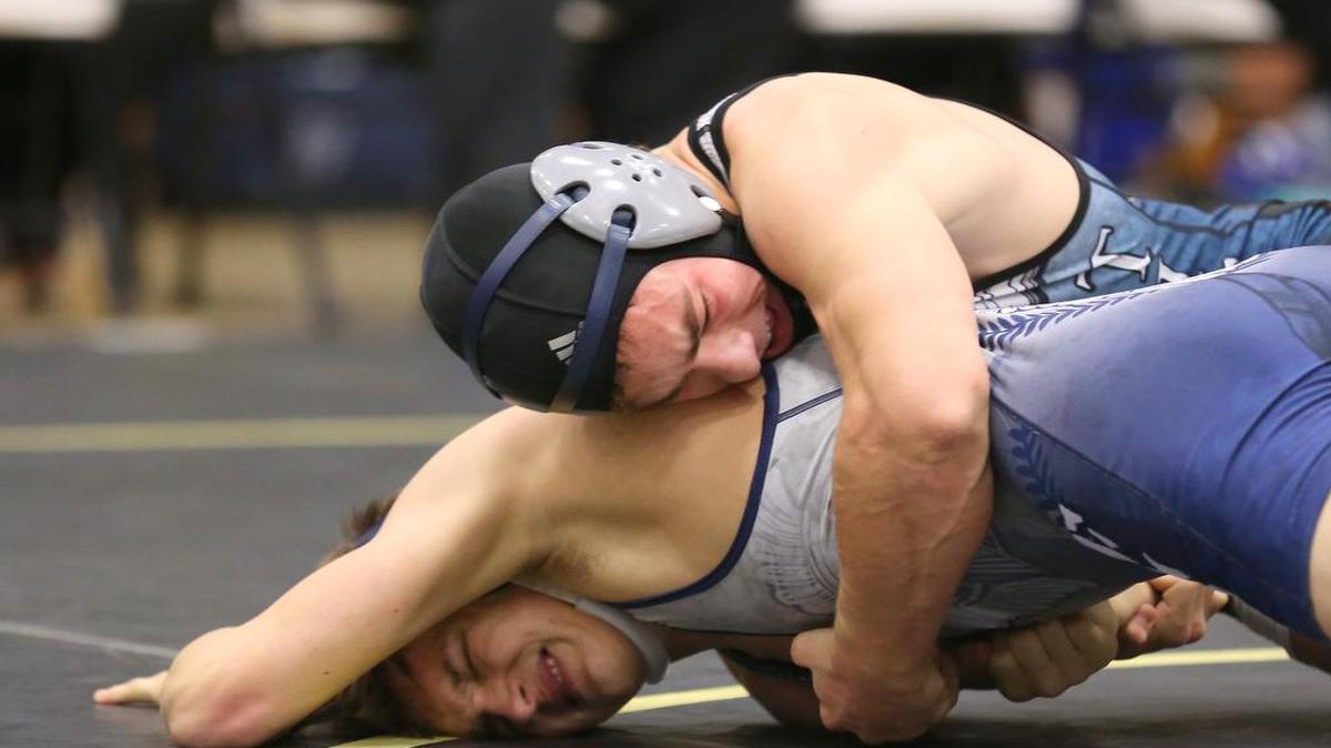 Lee’s Summit West senior Jake Woods (top) has a 40-0 record and will be one of a handful of Kansas City-area wrestlers looking to preserve their undefeated record this week at the Missouri wrestling state tournament in Columbia.