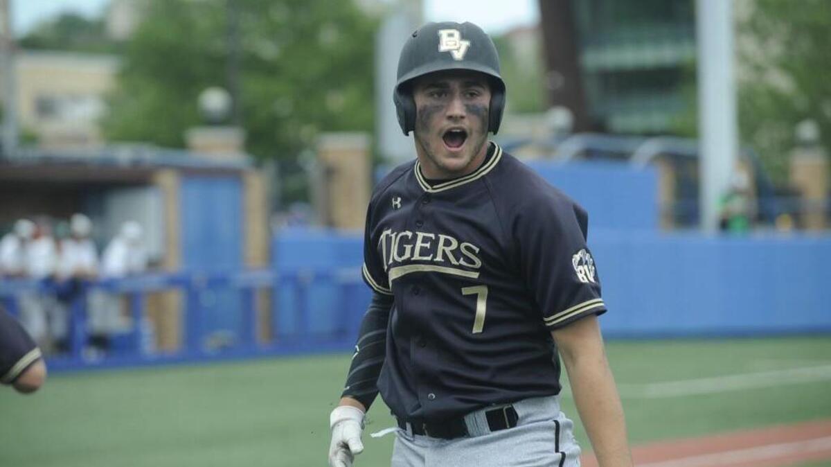 Blue Valley’s Walker Kinney reacts after scoring for the Tigers in their 3-1 win over Derby in the first round of the Class 6A state baseball tournament. Blue Valley went on to win the title.