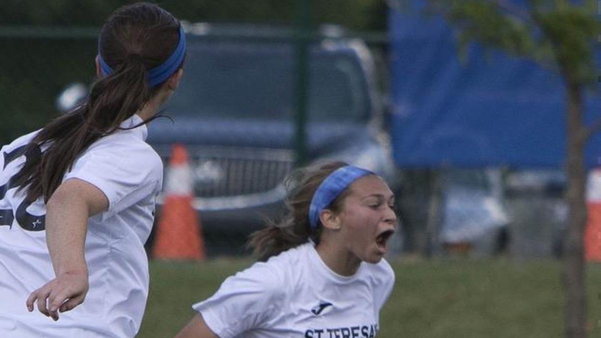 Lily Farkas (right) of St. Teresa’s Academy celebrated the first of her two goals at the Missouri Class 4 championship game against St Joseph’s Academy at Swope Park Soccer Village on June 4, 2016. St. Teresa’s won 4-2.