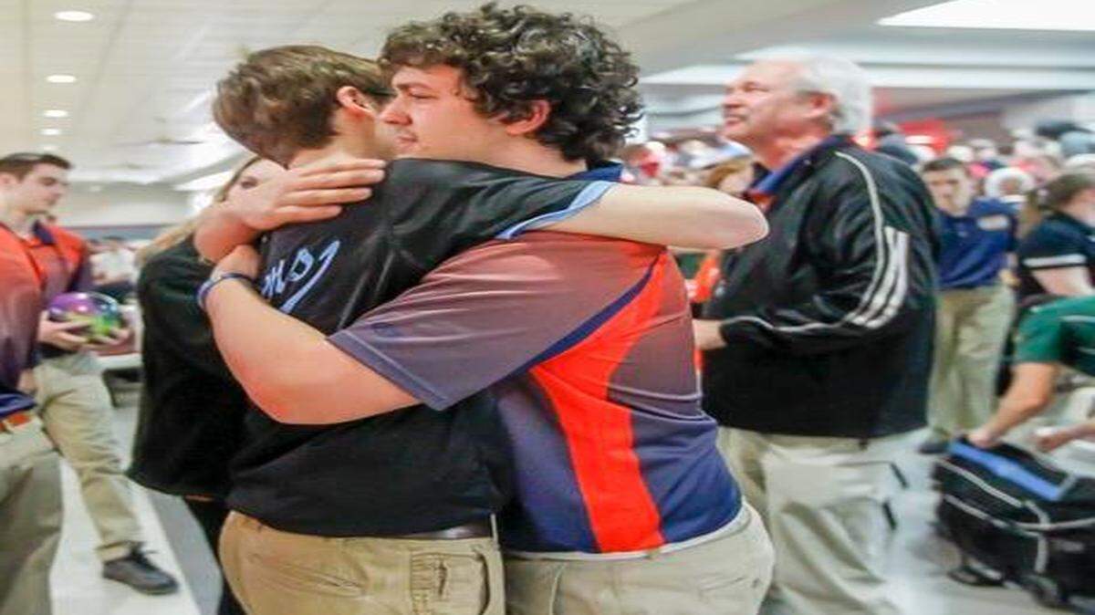 
Olathe East senior Jake Butler (right) got a hug from Shawnee Mission East’s Mike Thibodeau, son of Olathe East coach Chuck Thibodeau (left), at the 6A State Bowling Championships at Northrock Lanes in Wichita, Kan.


