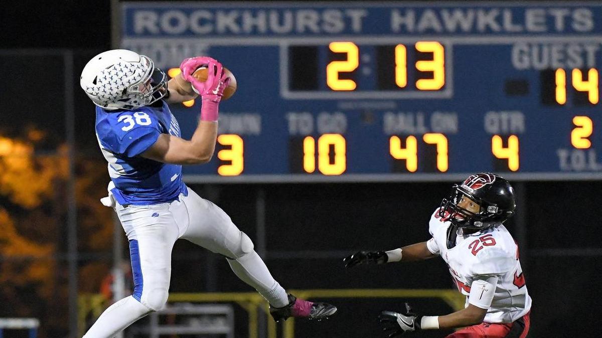 Rockhurst’s Brady McCanles catches a first down pass in front of Park Hill’s DaShaun Powell during a game on October 21, 2016 at Rockhurst High School in Kansas City, Mo.