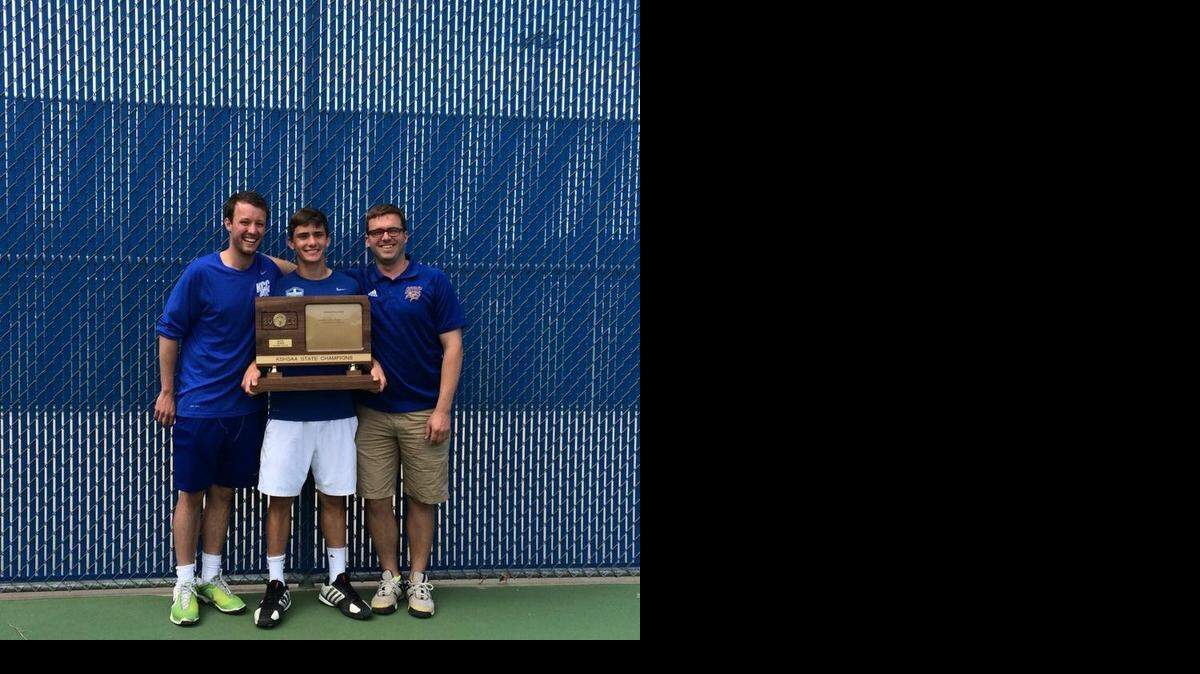 
Johnny Goodwin (center) celebrated his Kansas Class 3-1A state championship with his coaches.
