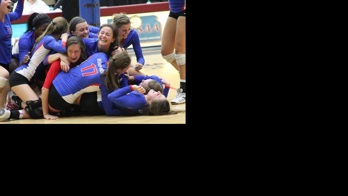 
Bishop Miege celebrated its recent 25-19, 25-12 victory over Topeka Hayden to capture the Kansas Class 4A Division I state title at the Bicentennial Center in Salina.
